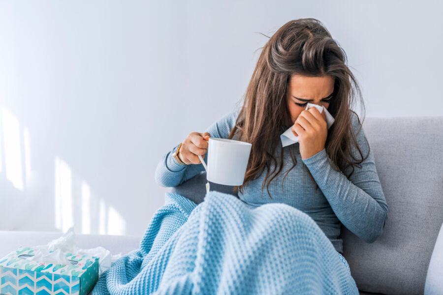 Sick,Woman,With,Headache,Sitting,Under,The,Blanket.,Sick,Woman