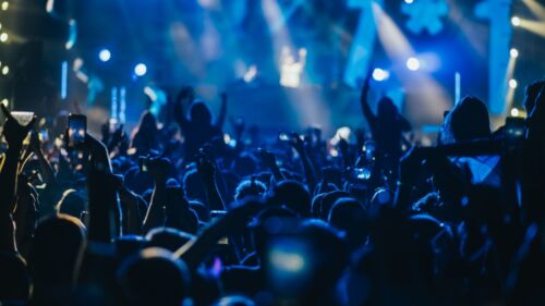 Large,Group,Of,Happy,People,Enjoying,Rock,Concert,And,Clapping